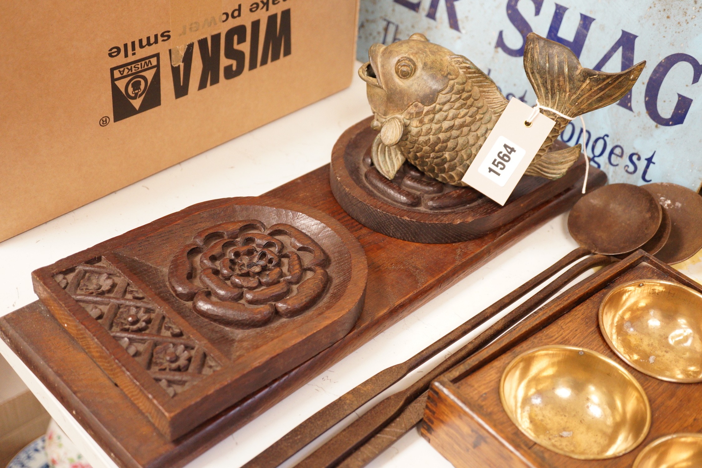 A carved oak book stand, brass spice box and others (6)